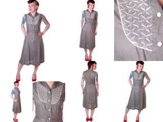  style dress is done in gray cotton, and features an interesing yoke 