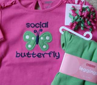   with a butterfly applique and the words SOCIAL BUTTERFLY on the front
