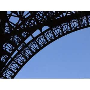  A Detailed Arch on the Eiffel Tower Against Blue Sky 