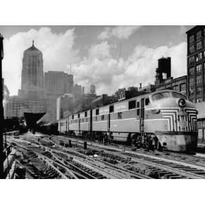 Passenger Train with a Streamlined Locomotive Leaving Chicago Station 