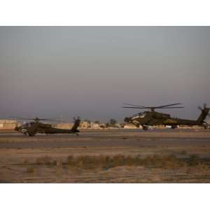 Two AH 64 Apache Helicopters Prepare for Takeoff Premium Poster Print 