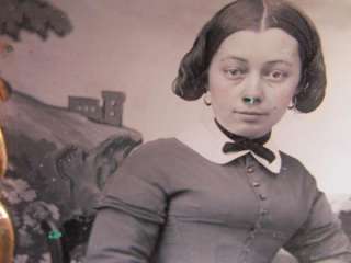 young woman sitting in front of backdrop daguerreotype  