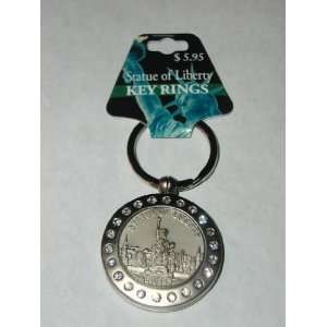 STATUE OF LIBERTY KEY RING. FEATURES A KEYRING WITH A MATTE SILVER 