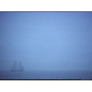  A Schooner Ship Sails Through Dense Fog off the Coast of 