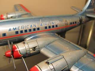 VINTAGE ANTIQUE LARGE TIN TOY AIRPLANE AMERICAN AIRLINES DC 7 LINEMAR 