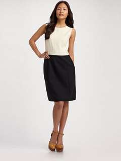   impeccably tailored this chic silhouette features a tweed bodice