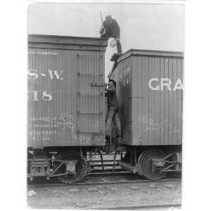  c1905,Railroad worker chasing tramp off train.