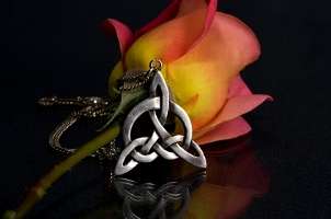 Celtic knot necklace and a beautiful pink rose