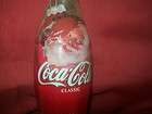 eight ounce coca cola classic bottle cap holiday 2004 santa