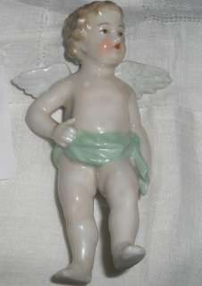 Porcelain cupid Figurine cherub Antique  