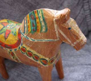 An old Dala horse painted with older patterns. He stands 5.8 inches 