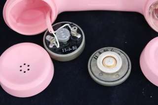 is marked 1952 and the pink plastic shell dial and handset have dates 