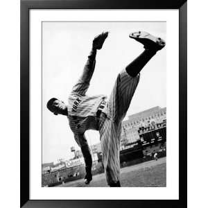 Satchel Paige, Pitcher for NY Black Yankees Showing Off His High Kick 