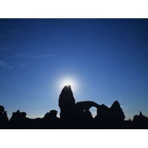  Silhouette of Rock Arches and Formations with Sun Shining 